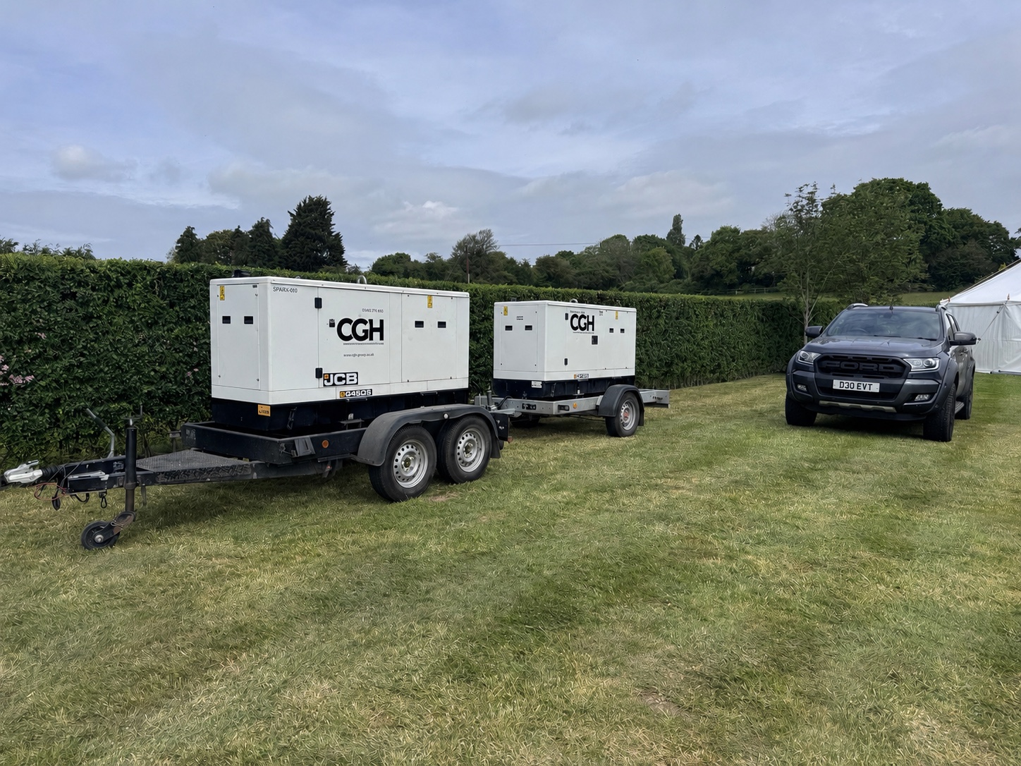 Cambridge Generator Hire mobile generators positioned on an outdoor event site
